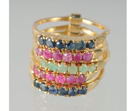 A GOLD PLATED SILVER SAPPHIRE, RUBY, AND EMERALD RING.