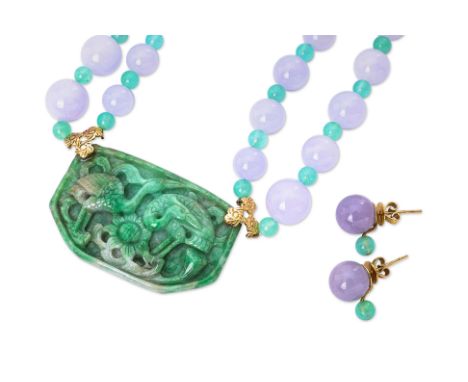 A SUITE OF JADE AND QUARTZ JEWELLERY
To include a carved jade pendant featuring two cranes and lotus flower, attached to a dy