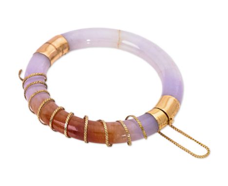 A GOLD MOUNTED JADE BANGLE
Featuring two parts of a jade bangle joined together by gold mounting and clasp marked '14K585', w