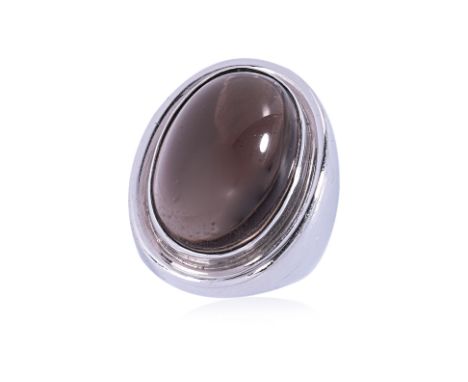 A SMOKEY QUARTZ CABOCHON RING Featuring a smokey quartz cabochon weighing approximately 30.0 Cts, mounted in an unmarked whit
