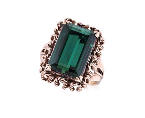 A GREEN TOURMALINE RING Featuring a green tourmaline weighing approximately 8.49 Cts (marked), mounted in a rose gold setting