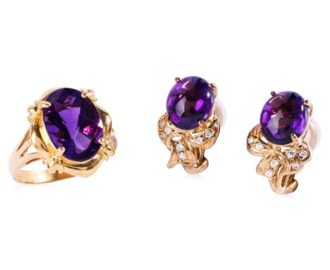 A PAIR OF AMETHYST CLIP EARRINGS AND AN AMETHYST RING
To include a pair of amethyst cabochons mounted in a yellow gold settin