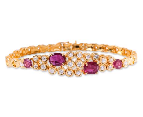 A RUBY AND DIAMOND BRACELET
Featuring oval cut rubies totalling approximately 2.69 Cts, mounted in a yellow gold setting mark