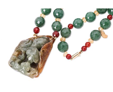 A LARGE CARVED JADE AND MULTI-GEM NECKLACE
Featuring a large carved jade, attached with unmarked yellow metal to a necklace w