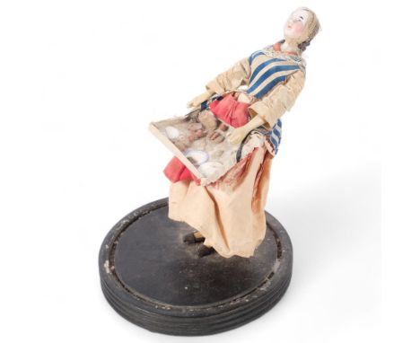 A Vintage female peddler figurine with ceramic head, on stand, figure height 19cmFigure is in A/F condition, visible cracks a