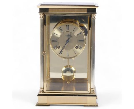 Hermle, Germany, a brass-cased 3-glass panel 8-day striking mantel clock, with key and pendulum, H28cm 