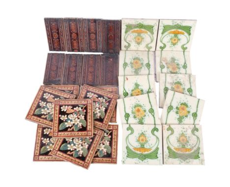 A set of 8 Simpson's Edwardian tiles with floral designs, and a set of 10 tiles for a fireplace, and various half tiles, in p