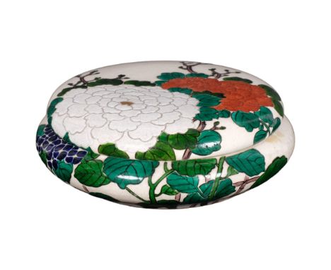 In the manner of Ninsei, a Japanese crackle glaze circular box and cover, hand painted red green and white enamel decoration,