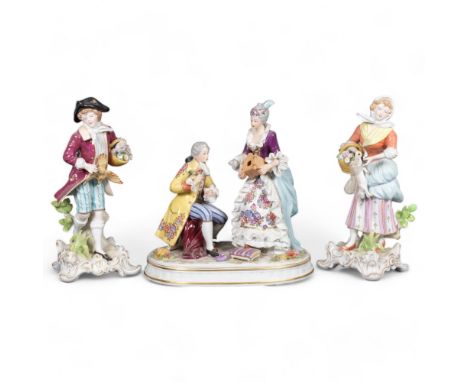 A pair of Sitzendorf figures with flower baskets, 22cm, and a porcelain group on plinth 