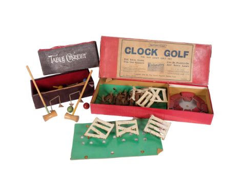 Early 20th century clock golf set, boxed, and a boxed table croquet game (2) 