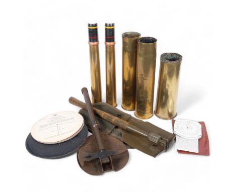 3 First World War brass shell cases, 2 Second World War brass shell cases, 2 trench spades, a hydrographic Office no. 2102-C 