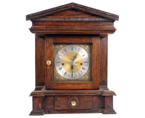 A large oak-cased Arts and Crafts style mantel clock with 3-train movement, H47cm, with drawer under 