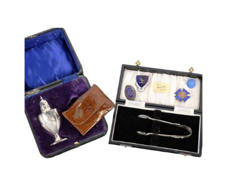 A cased silver pepperette, a cased pair of silver sugar tongs, 4 enamel badges including 1 silver 