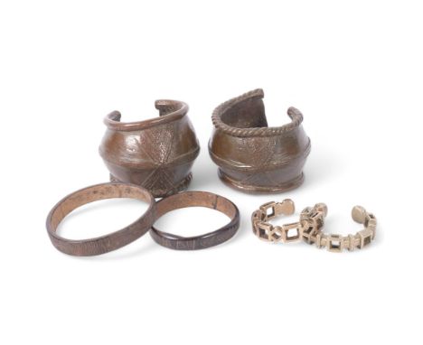 Pair of African bronze bracelets, 2 nickel currency bracelets, and 2 elephant hide bangles 