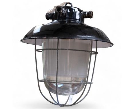 A heavy duty Vintage industrial black enamel factory hanging lamp, with thick glass lens and protective wire caging, unmarked