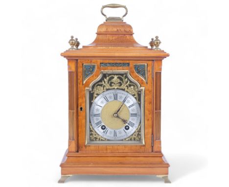 A German walnut-cased bracket clock, 8-day striking movement, with silver chapter ring and Roman numerals, fretwork pierced p