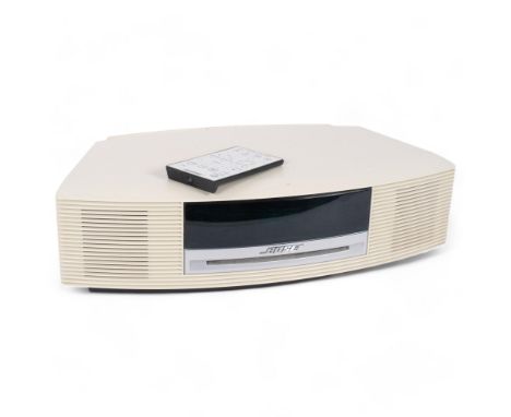A Bose Wave music system, radio and CD player, model AWRCC6, with remote control and associated cables 