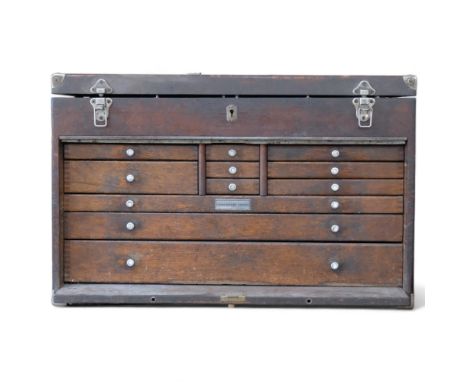 A 20th century stained wood engineer's cabinet and associated tools, to include gauges, micrometres, pressure gauges, etc, ca