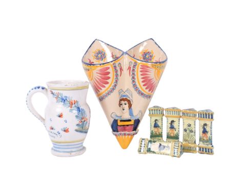 A Quimper double wall pocket, H25cm, jug, and a set of 5 Quimper knife rests with painted designs 