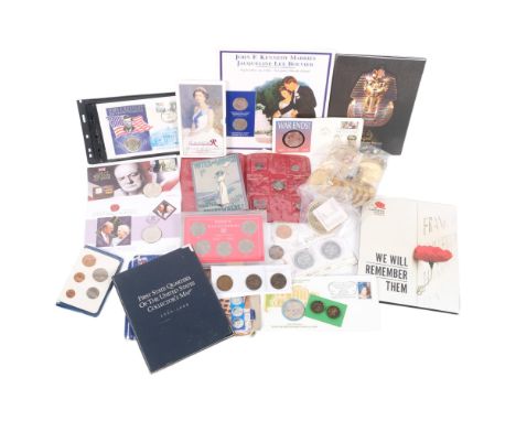 A group of cased commemorative coins and medals, including George VI half crowns, Kennedy Tribute, and Harry Potter 
