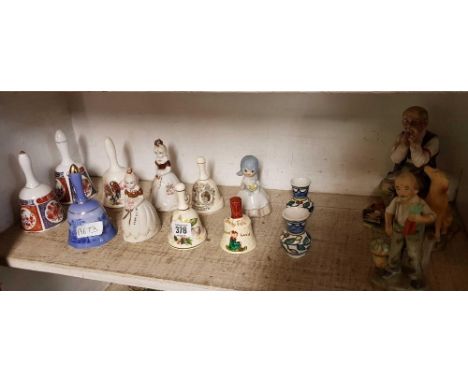 SHELF OF DECORATIVE CHINA BELLS ETC