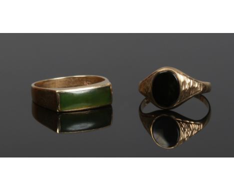 Two gent's 9ct gold signet rings. One set with onyx (size P 1/2), the other a jade coloured hardstone (size Q).
