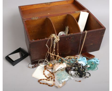 A stained wood three compartment box and contents including postcards, brooches, vintage buttons, costume jewellery, cameos e