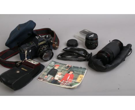 A Canon T50 35mm SLR film camera with Canon 50mm lens, two Cobra lenses, instruction manual 244T hot shoe flash etc.