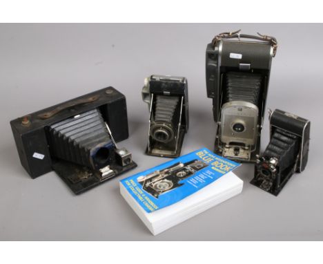 A Polaroid land camera model 150 and three other Bellows cameras including Kodak tourist, Agta and Eastman Kodak and a Hove I