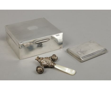 A silver cigarette box assayed Birmingham 1939, a silver Art Deco match case assayed Birmingham 1939 and a silver and mother 