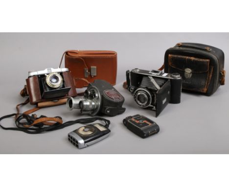 A collection of vintage cameras including Solida Jr Bellows camera, Univex AF-2 miniature, Ensign Selfix 420, a Bell &amp; Ho