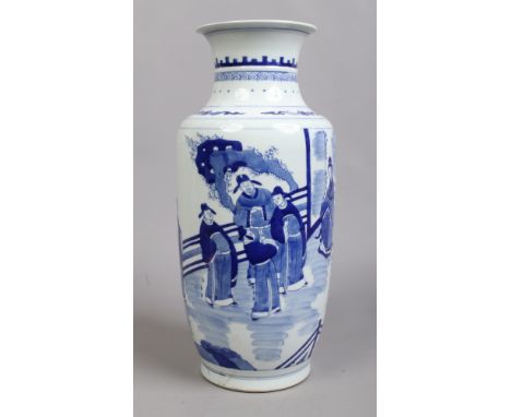 A Chinese blue and white vase. Painted in underglaze blue with a dignitary, his companion and attendants. Six character Kangx