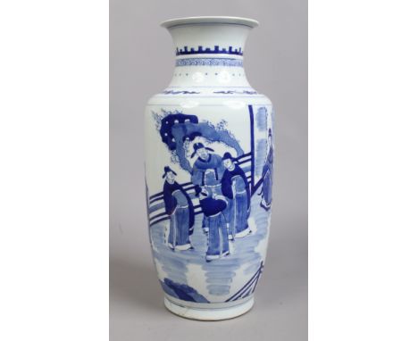 A Chinese blue and white vase. Painted in underglaze blue with a dignitary, his companion and attendants. Six character Kangx