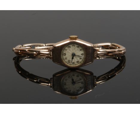 A vintage 9ct gold ladies manual bracelet watch on 9ct gold expanding strap. (Gross weight 13.1g)