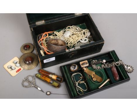 An antique green leather locking jewellery box and contents of good quality costume jewellery and collectables including a ye