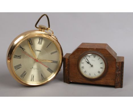 An oak cased Art Deco 8 day mantel clock, along with a novelty Coral wall clock formed as an over sized pocket watch.
