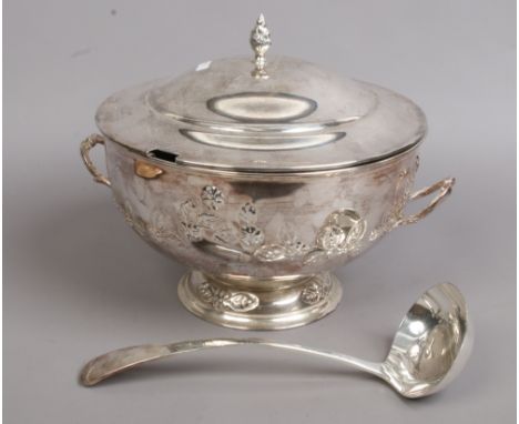 A silver plated soup tureen and cover with ladle.