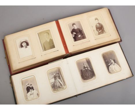 Two Victorian photograph albums and contents of vintage monochrome photos.