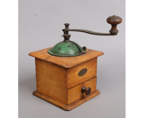 A vintage French coffee grinder.