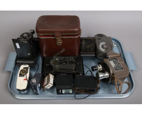 A collection of cameras, Cine cameras and photographic equipment including a Kodak Eastman Vest pocket model B, Kodak Jr, Raj