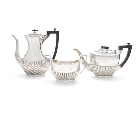 A MATCHED THREE PIECE SILVER TEA AND COFFEE SERVICE, of corresponding design; comprising a coffee pot, tea-pot and sugar bowl