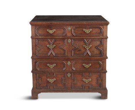 AN 18TH CENTURY OAK CAMPAIGN CHEST, with moulded rectangular top, over four long drawers of two different depths, the moulded