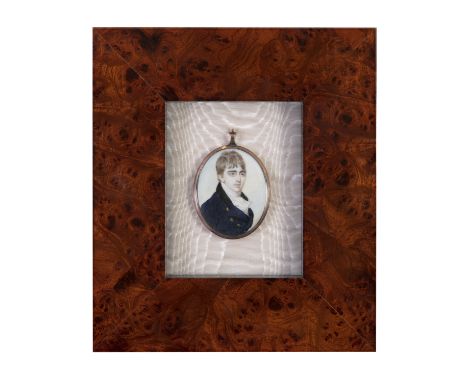 ENGLISH SCHOOL (LATE 18TH CENTURY)Portrait of gentleman wearing a blue overcoatWatercolour on ivory, oval, 7 x 5.5 cmContaine