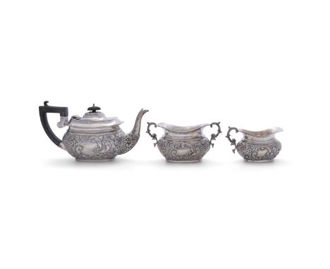 A MATCHED THREE-PIECE SILVER TEA SERVICE, of compact proportions, comprising:- Teapot, Chester c.1907, mark of George Nathan 