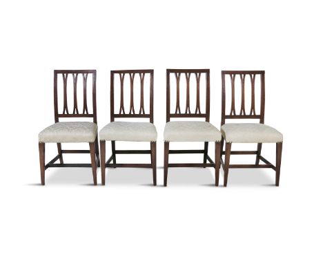 A SET OF FOUR IRISH 'FORK BACK' MAHOGANY DINING CHAIRS, c.1825, each with pierced rectangular back and upholstered seat, on s