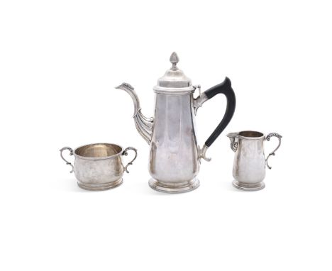 AN IRISH SILVER GEORGIAN STYLE COFFEE POT, Dublin c.1971, mark of Royal Irish Silver Co., of plain tapering cylindrical form,