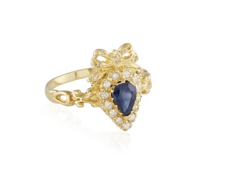 A SAPPHIRE AND DIAMOND RING, the pear-shaped sapphire within a surround of brilliant-cut diamonds, mounted in 18K gold, ring 