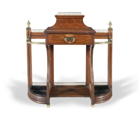 A VICTORIAN MAHOGANY BRASS MOUNTED STICK STAND, attributed to James Shoolbred &amp; Co., the single frieze drawer stamped wit