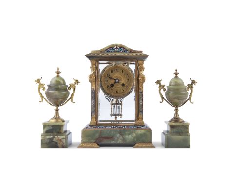 A FRENCH ONYX AND CHAMPLEVE ENAMEL CLOCK GARNITURE, c.1900, with gilt metal dial and Arabic numerals, blued steel hands, with