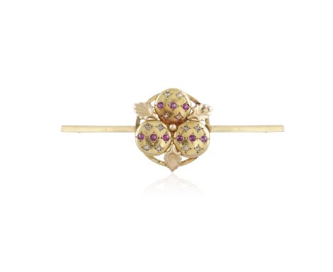A RUBY AND DIAMOND BAR BROOCH, the brooch centrally decorated with circular-cut rubies and rose-cut diamonds within star-moti